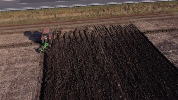 Red tractor go in frame, Ukraine