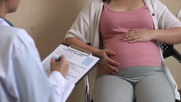 Pregnant Woman and Gynecologist Doctor at Hospital