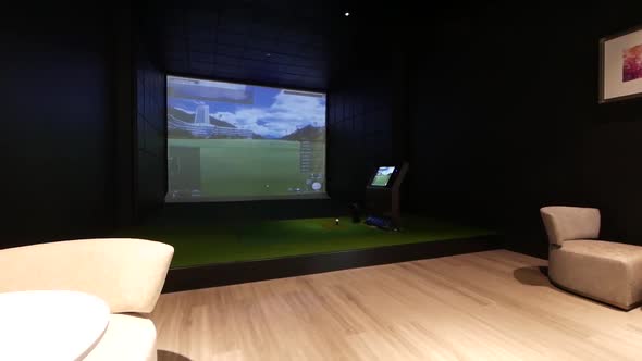 Walking Through the Golf Simulator Room decorated with the cosy armchairs