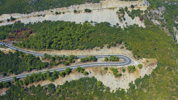 Aerial View of Hairpin Bend Road in Mountains