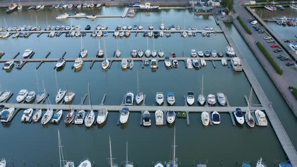 Close-up aerial view of boats tied up in dock along Helsinki, Finland waterfront.