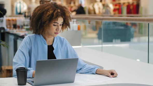 African American Busy Girl Business Woman with Laptop in Cafe Office Company Workplace Checking Data