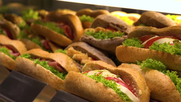 Closeup on Sub Sandwiches on Display on a Counter in a Store