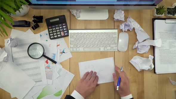 Businessman Working At Table With Crumpled Papers Flat Lay