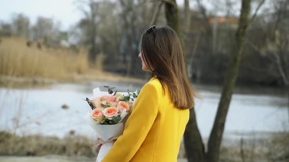 Portrait of Girl Walking on the River Beach with Flowers, Relationship Hard Concept Outdoors