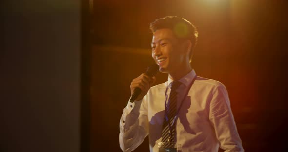 Young Asian businessman speaking in business seminar at auditorium 4k