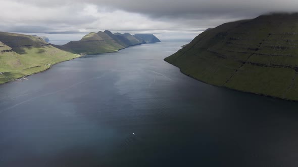 Drone Over Klakkur Mountain Coastline And Sea Below