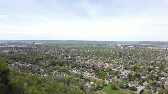 Mesmerizing aerial view of rural community in valley in Wisconsin with Mississippi River in distance