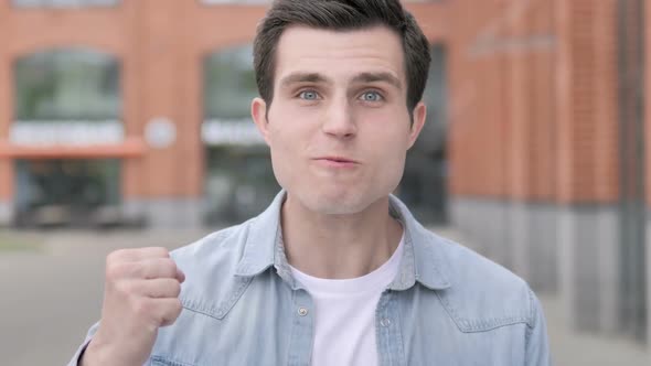 Angry Young Man Yelling Outdoor