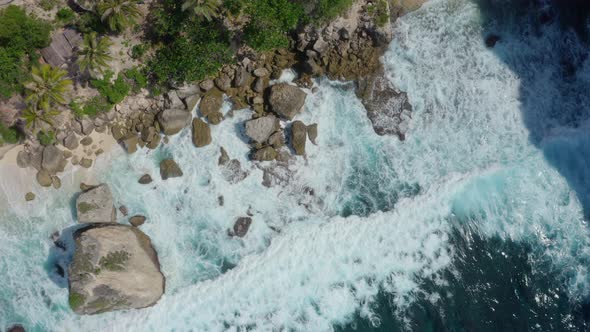 Top Down Aerial View of Azure Blue Water Ocean Waves Crashing on Wild Beach