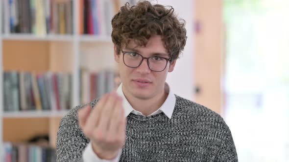 Portrait of Young Man Pointing and Inviting