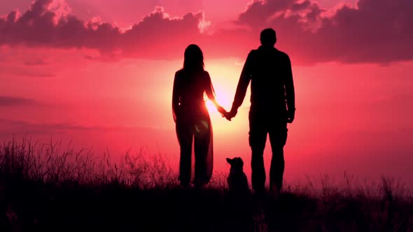 Couple with Dog Posing at Sunrise