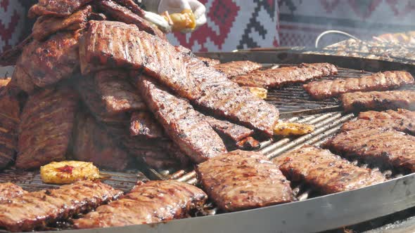 Roasted Pork Ribs are Grilled on Charcoal Big Spinning Grill