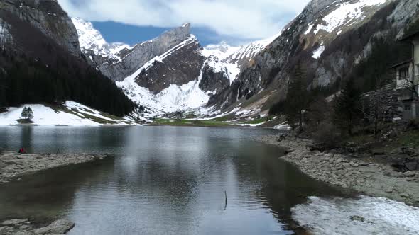 The View From The Height Of The Snow Capped Mountains And Lake Seealpsee