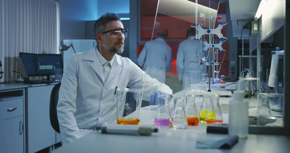 Scientist Using a Flat Transparent Display Screen alt
