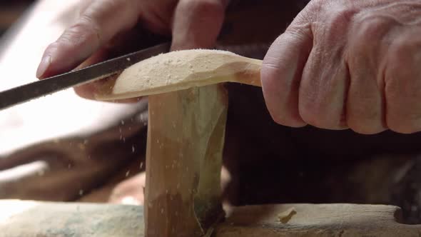 Making wooden spoons by processing wood.