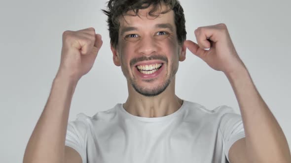 Portrait of Excited Young Casual Man Celebrating Success