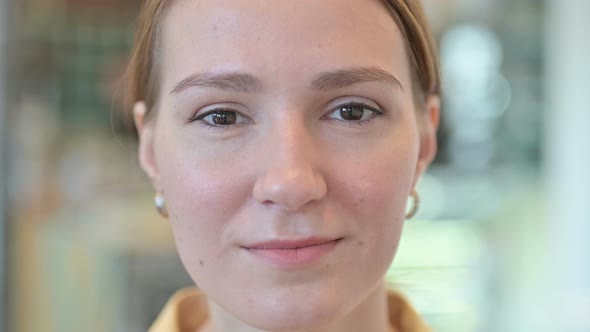 Close Up of Serious Face of Young Woman 