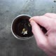 Top View of Person Hand Steering Coffee in a Cup with Spoon - VideoHive Item for Sale