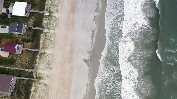 Drone Flying Over Ocean Waves Crashing on the Beach