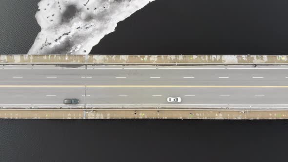 Cars on Bridge Travelling Cross Frozen Charles River, Boston, Massachusetts