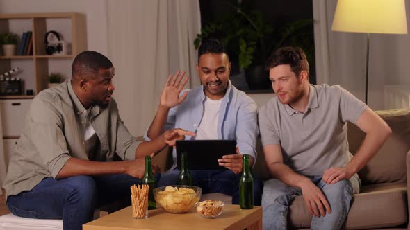 Male Friends with Tablet Pc Drinking Beer at Home