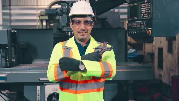 Young Factory Worker or Engineer Close Up Portrait in Factory