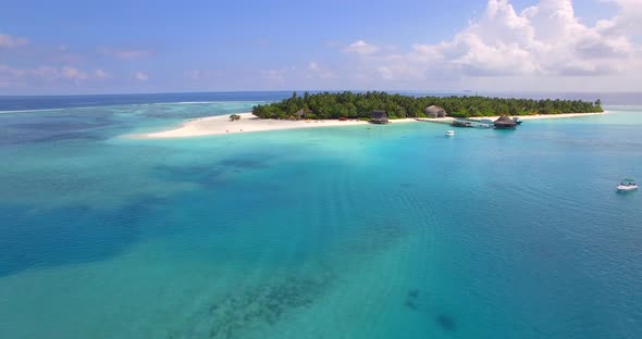 Aerial drone view of a scenic tropical island in the Maldives