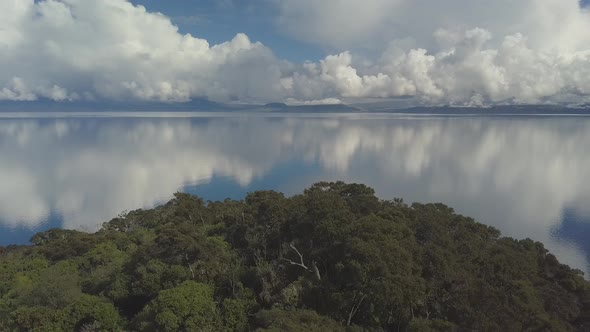 Flyover above tiny island