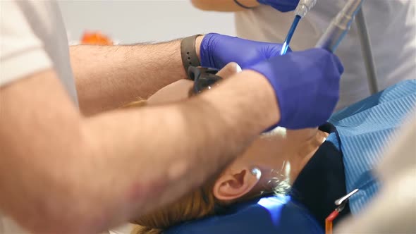 Dentist Treating Woman Patient