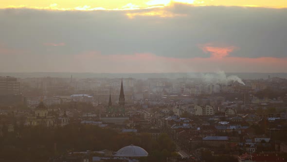 Bright Orange Sunset Over the City with Building Silhouette