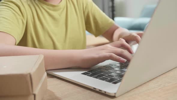Close Up Of Hand's Young Girl Typing On Computer