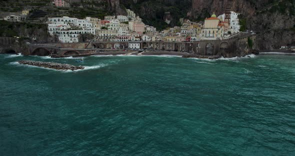 Establishing Aerial Tilt-up to Spiaggia di Atrani Town on Amalfi Coast, Italy