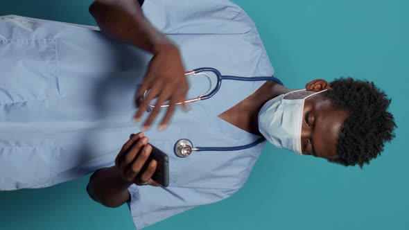 Medical Assistant Wearing Face Mask to Protect From Virus