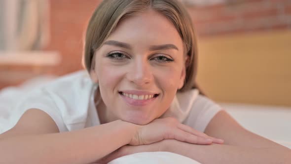 Close Up of Beautiful Creative Young Woman Smiling at the Camera