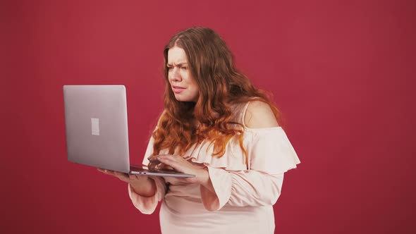 Disappointed Oversize Lady Looking at Laptop and Making Facepalm Gesture Having Some Connection