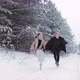 Happy Female Couple Running Through the Woods Holding Hands - VideoHive Item for Sale