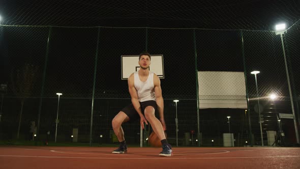 Young basketball player dribbling the ball