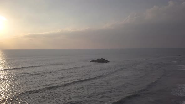 Beautiful Rocky Island. Ocean Waves Break Off the Shore