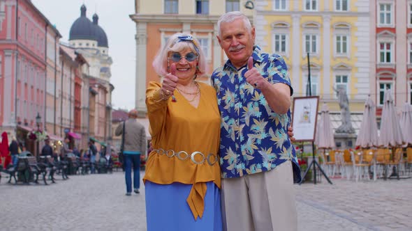 Senior Grandmother Grandfather Tourists Raises Thumbs Up Agrees with Something Recommends Likes Good