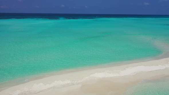 Aerial view scenery of exotic tourist beach break by blue sea and white sandy background of a dayout