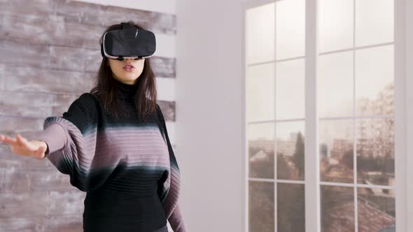 Beautiful Female Home Designer Using Virtual Reality Goggles
