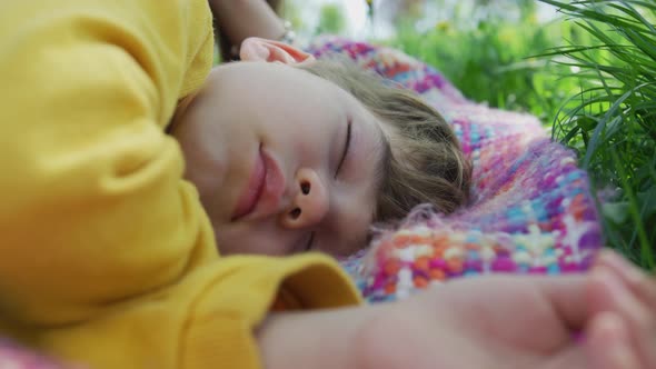 Boy sleeping on a blanket