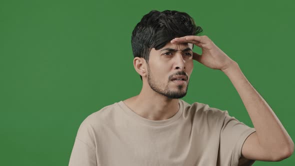 Arabic Puzzled Man Stand on Green Background Brunette Male Portrait Hispanic Indian Guy Puts Hand to