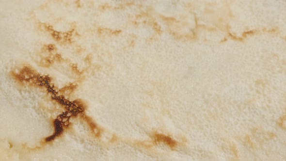 Tasty dessert surface after frying slow tilt 4K 2160p 30fps UltraHD  footage - Texture of pancake af
