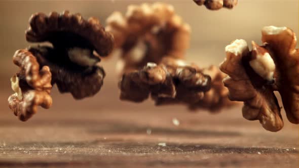 Peeled Walnuts Fall on the Table