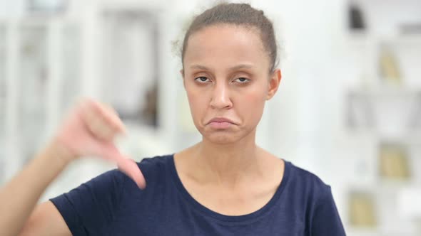 Portrait of Disappointed African Woman Doing Thumbs Down