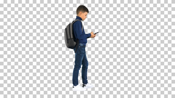 Schoolboy with a backpack using mobile phone, Alpha Channel