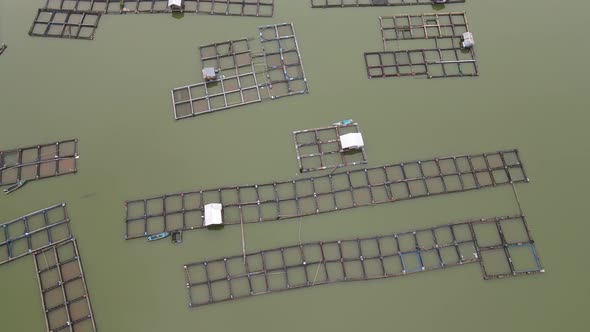 Aerial view of traditional floating fish pond on lake in Indonesia