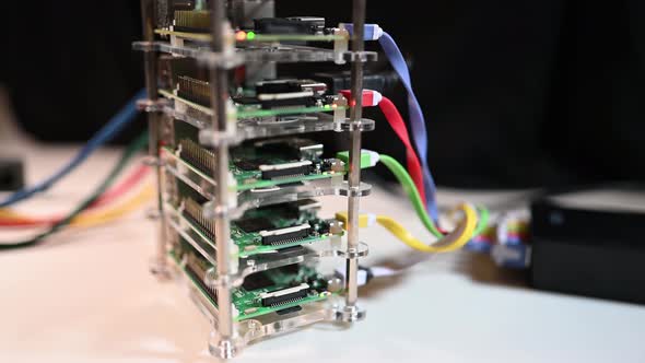 Raspberry PI supercomputing cluster. Power source pan to cluster.  Bitcoin mining, science fair, the